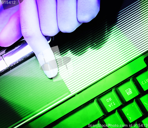 Image of Working at laptop .