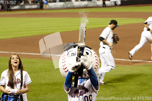 Image of Mr. Mets shooting T-Shirt gun