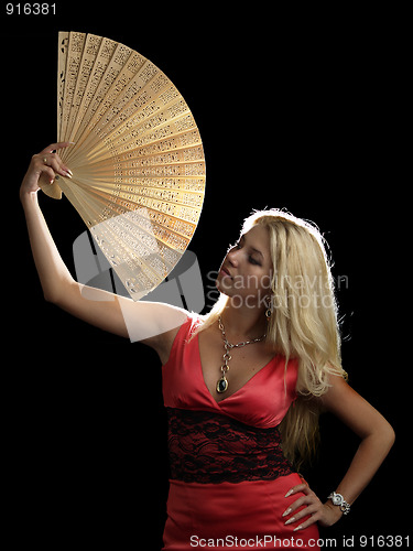 Image of Hot blonde in red dress with fan