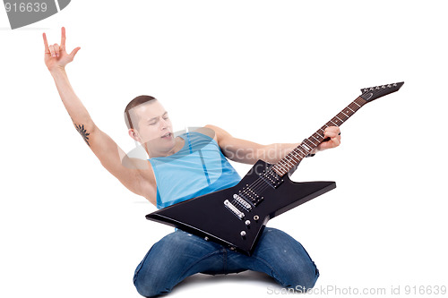 Image of playing guitar on knees