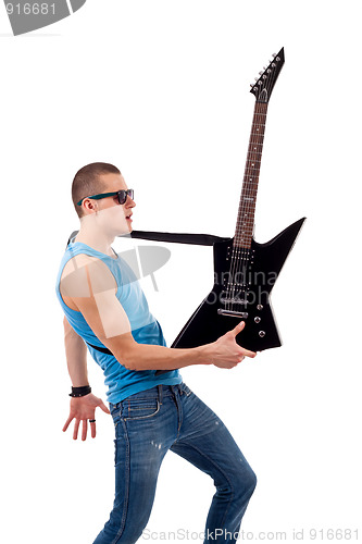 Image of guitarist holding his guitar in one hand