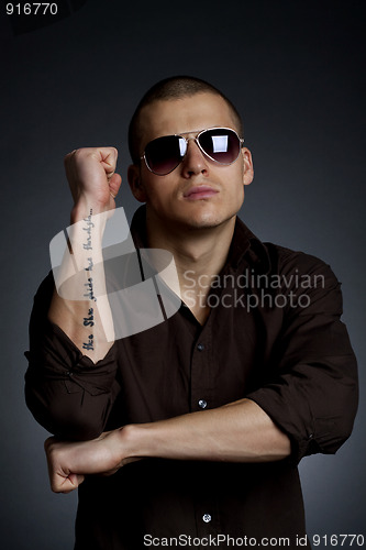 Image of man making a hand sign