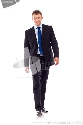 Image of young businessman is walking