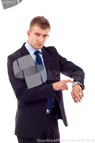 Image of  looking and pointing at his watch