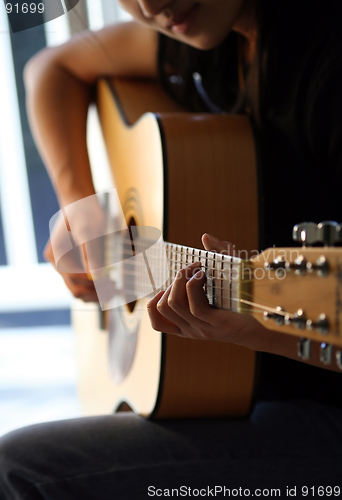 Image of Playing guitar