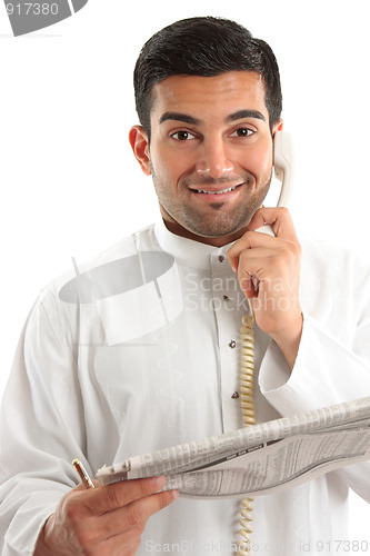 Image of Happy businessman with financial newspaper