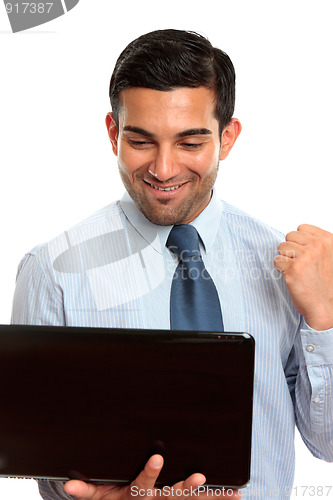 Image of Happy business man with latpop computer