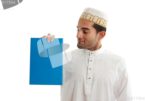 Image of Ethnic businessman holding brochure