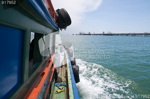 Image of Old, wooden supply boat in Thailand.