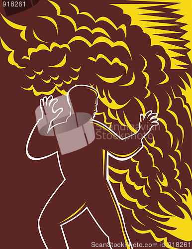 Image of Man scared in front of burning fire