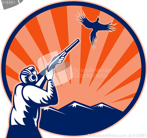 Image of Hunter aiming shotgun rifle at bird pheasant