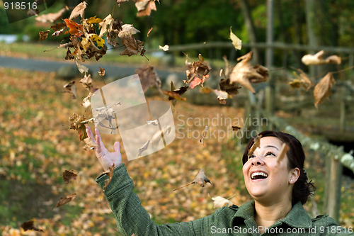 Image of Falling Leaves Girl