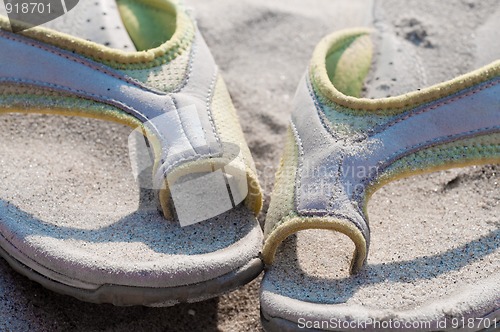Image of  Flip-flops and sand