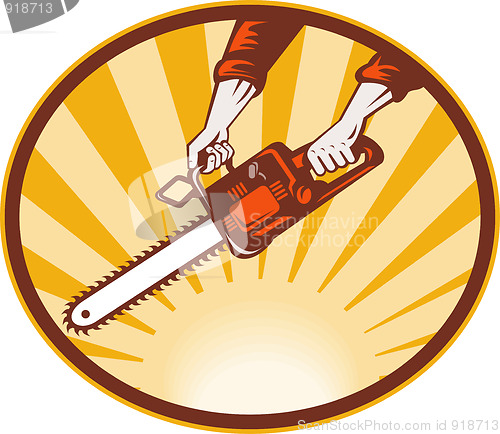 Image of hand holding chainsaw 