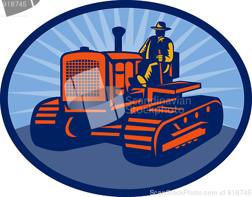 Image of Farmer driving vintage tractor