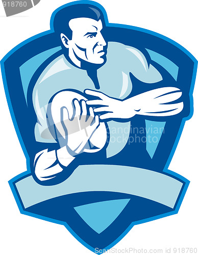 Image of Rugby player running with ball with shield 