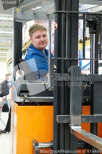 Image of warehouse truck loader driver