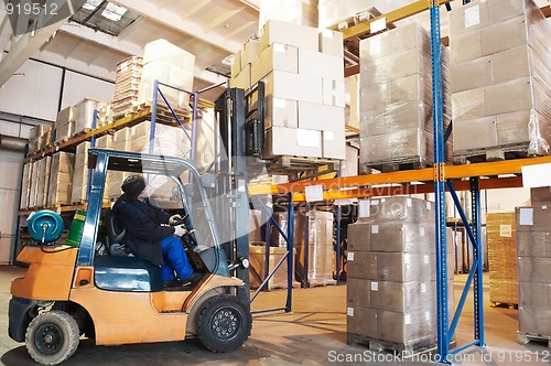 Image of warehouse forklift loader worker