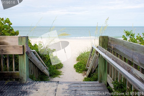 Image of wooden walkway leading to beach