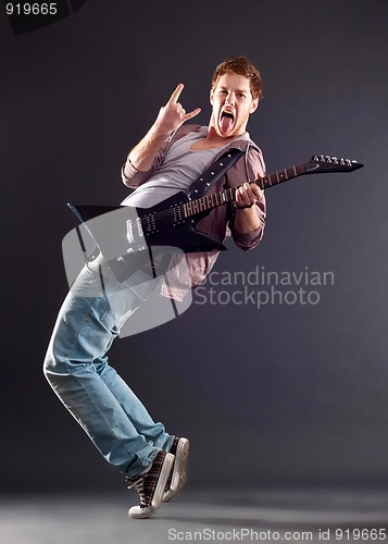 Image of young man with guitar