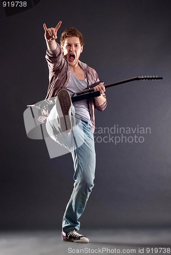 Image of  kicking guitarist