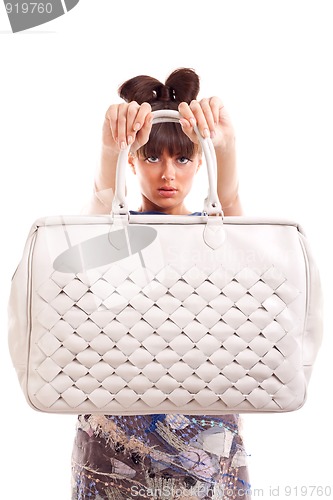 Image of woman presenting purse