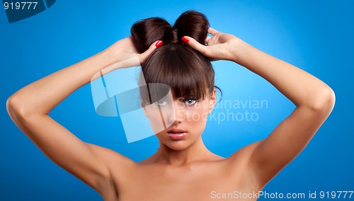 Image of woman holding her hair