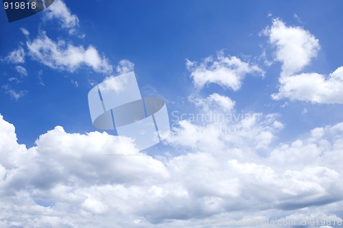 Image of bright blue sky with white clouds on sunny day