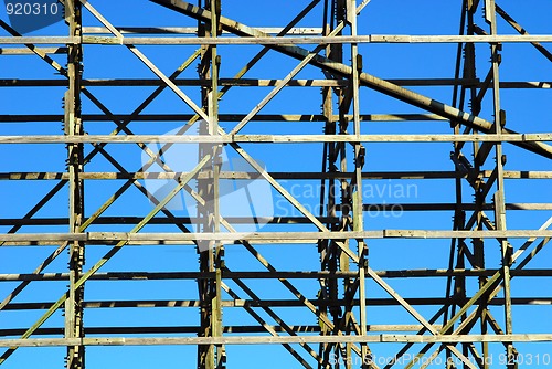 Image of wooden framework against blue sky