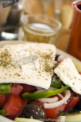 Image of greek salad with house wine