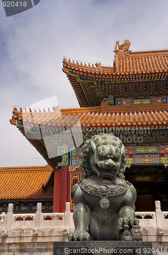 Image of Beijing Forbidden City: lion against the corner of a roof.