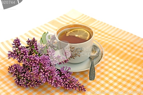 Image of A cup of tea with lemon and lilac
