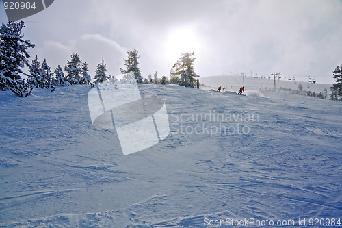 Image of Skiers on the slope at winter resort