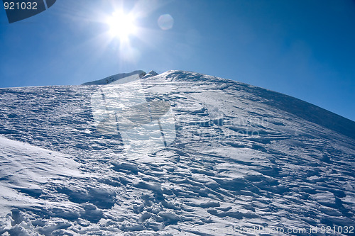 Image of Winter mountains landscape against the sun