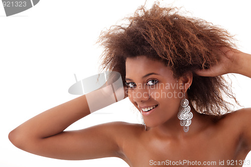 Image of beautiful black woman, holding her hair with his hands