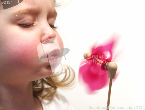 Image of girl blowing pinwheel