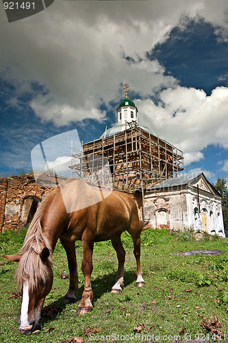 Image of The horse and old church