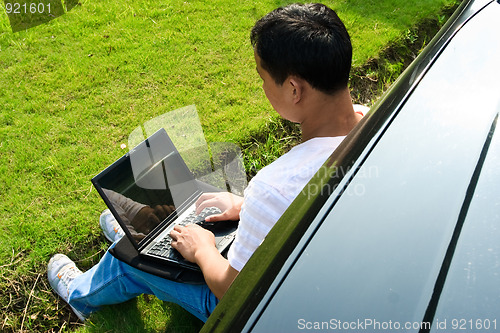 Image of man using laptop