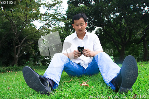 Image of man using cellphone