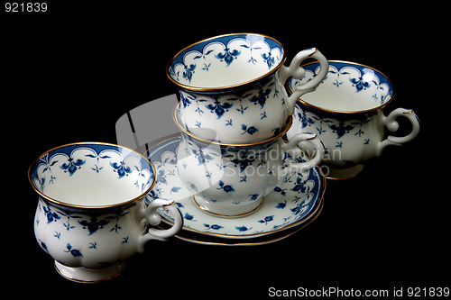 Image of Four tea cups on saucer