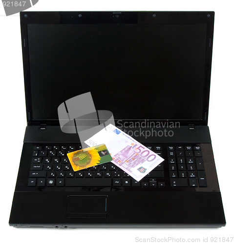 Image of Yellow bank card rests upon keyboard