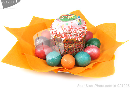 Image of Easter pie in glaze and dyed egg on orange napkin
