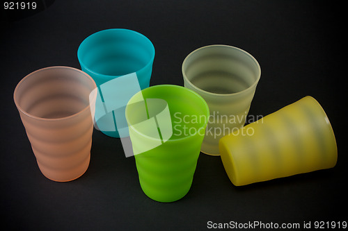 Image of Colour plastic glasses on dark background