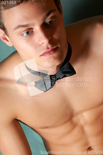 Image of Shirtless young man with bowtie