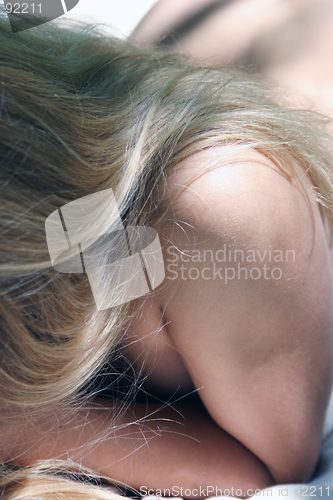 Image of Blonde hair, bare shoulder