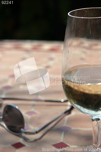 Image of Half full glass of white wine