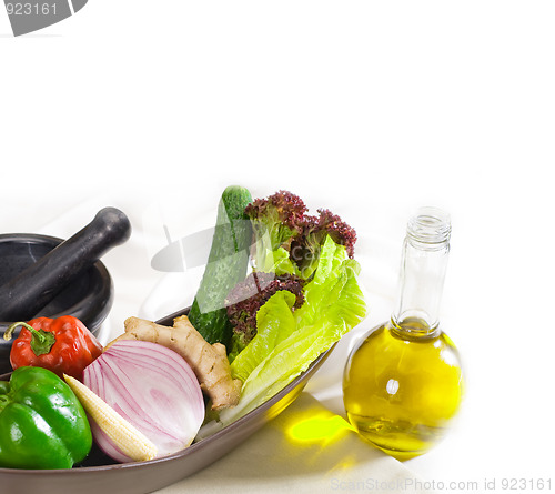 Image of assorted vegetables and extra virgin olive oil