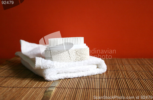 Image of Pumice brush and towel at a spa - health and beauty