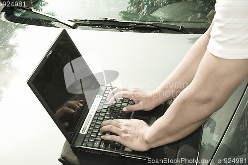 Image of man using laptop