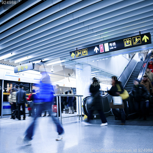 Image of rushing people